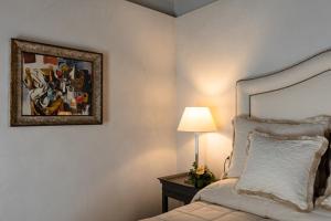 Postel nebo postele na pokoji v ubytování CORTE SAGGIN Charme Relais