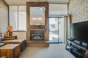 a living room with a fireplace and a television at Family Friendly Condo - Park City (Sleeps 8+) in Park City