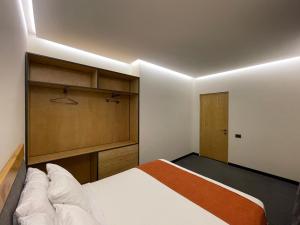 Ένα ή περισσότερα κρεβάτια σε δωμάτιο στο MIST Boutique Hotel