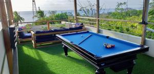 a pool table on the balcony of a house at Alquiler de Casa Completa-Casa Iguana Del Mar in San Andrés