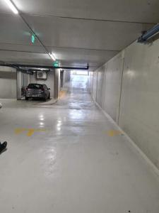 an empty parking garage with a car parked in it at Vienna Top Apartment with Parking, great surroundings in Vienna