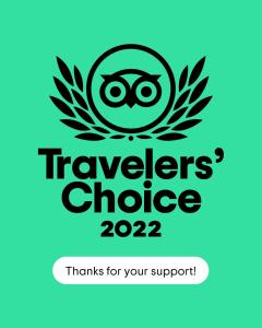 a sticker with the words travellers choice thanks for your support at Carramar Motor Inn in Palmerston North