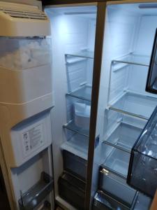 an empty refrigerator with its door open and its shelves at Vienna Top Apartment with Parking, great surroundings in Vienna