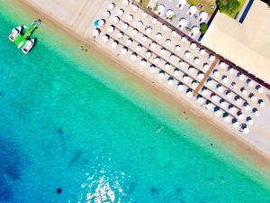 an aerial view of a beach with umbrellas and the ocean at Luxury Villa Barbati Sun with private pool by DadoVillas in Barbati