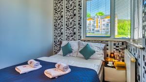 Posteľ alebo postele v izbe v ubytovaní Apartament Maki - 5D Apartamenty