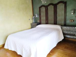 A bed or beds in a room at Camino a Casa - Suances