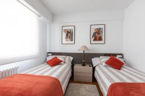 Postelja oz. postelje v sobi nastanitve Luminoso apartamento en Cuatro Caminos