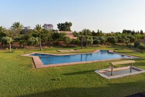 an overhead view of a swimming pool in a park at Villa Marrakech in Marrakesh