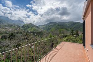 a balcony of a house with a view of mountains at Il Casale di Don Matteo in Vico Equense