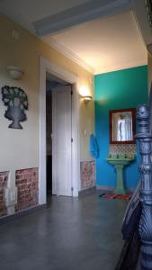 a room with a door and a mirror on the wall at Chez Laurel in Rio de Janeiro