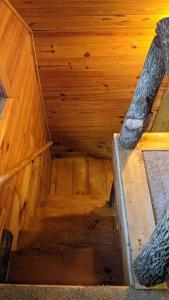 an overhead view of a wooden stairs in a room at Woodard Cabin in Cullowhee
