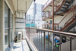 an empty balcony of an apartment building at G&R House 102 in Tokyo