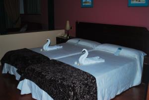 Cama o camas de una habitación en Hotel Puerto de Las Nieves