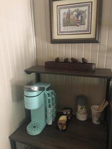 a coffee maker on a shelf in a kitchen at Acorn Hideaways Canton Sweet Tweet Guesthouse King Bed in Canton