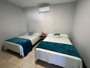Ένα ή περισσότερα κρεβάτια σε δωμάτιο στο Dpto CASA BRISA! a 600 metros de Playa&Malecon! Alberca! +15 φωτογραφίες