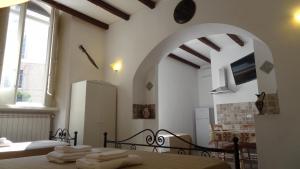 a bedroom with a bed with towels on it at Sparta in Taranto