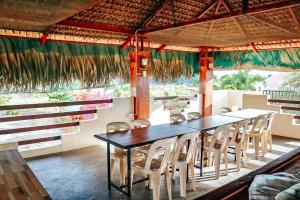 a dining room with a table and chairs at Airport View Hotel Vigan in Vigan