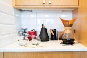 a kitchen counter with various appliances on it at Amorcito de Jenny - Shared House in Portland