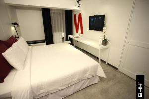 Katil atau katil-katil dalam bilik di BTH Hotel – Boutique Concept