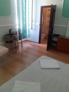 Postel nebo postele na pokoji v ubytování R.T. HOUSE'S