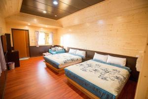 Postel nebo postele na pokoji v ubytování Xiaoliuqiu Happy House B&B + 37 fotografií