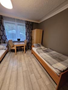 Postel nebo postele na pokoji v ubytování Dom Gościnny Sosenka Grzybowo