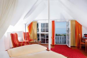 Un pat sau paturi într-o cameră la Hotel Seeperle