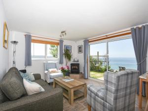 a living room with a view of the ocean at Glenavon in Torpoint