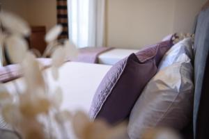 Postel nebo postele na pokoji v ubytování 6 Milje Hotel