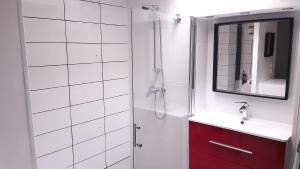 a bathroom with a shower and a sink and a mirror at LE TRANSAT 40m de la plage in Palavas-les-Flots +141 photos
