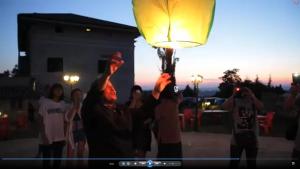 a group of people holding up a light in the air at Villa Dei Romani - Country House in Guidonia