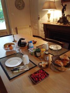 a table with bread and other food on it at Au fil de l'eau in Cerdon +21 photos