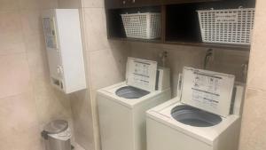a bathroom with two toilets in a room at Toyoko Inn Osaka Namba Nippombashi in Osaka