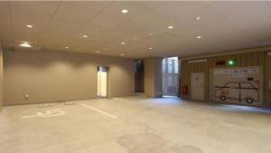 an empty room with a large room with a car garage at Toyoko Inn Osaka Namba Nippombashi in Osaka