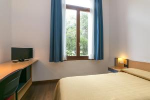 Llit o llits en una habitació de Isola di San Servolo - Centro Soggiorno