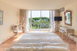 מיטה או מיטות בחדר ב-Villa Capilla, sea view