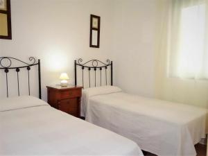 Posteľ alebo postele v izbe v ubytovaní Apartamento en Atlanterra Playa 33A