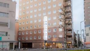 a building with a sign on the side of it at Toyoko Inn Tokyo Akabane-eki Higashi-guchi in Tokyo +29 photos