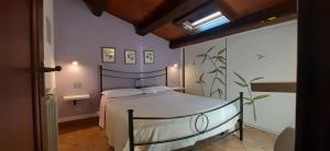 Tempat tidur dalam kamar di Il Mulino
