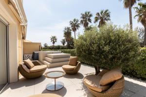 Posezení v ubytování Le Palm Beach + 3 fotografie