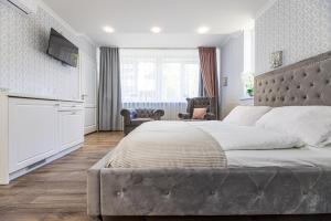 Postel nebo postele na pokoji v ubytování Palanga Park Hotel + 32 fotografií