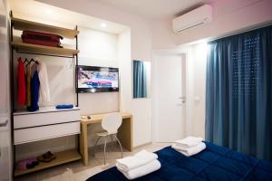 Televisyen dan/atau pusat hiburan di B&B DELICIUS