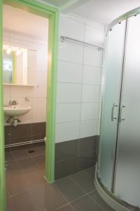 a bathroom with a shower and a sink at STAVROS Studio Apartment in kos town in Kos