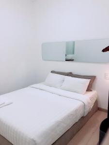 Postel nebo postele na pokoji v ubytování Whammy House Dalat