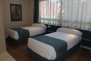 Postel nebo postele na pokoji v ubytování Modo Hotel Apartamento