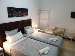 Postel nebo postele na pokoji v ubytování Hostal Absolut Stay