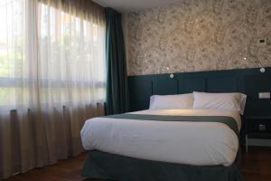 Postel nebo postele na pokoji v ubytování Modo Hotel Apartamento