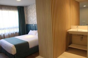 Postel nebo postele na pokoji v ubytování Modo Hotel Apartamento