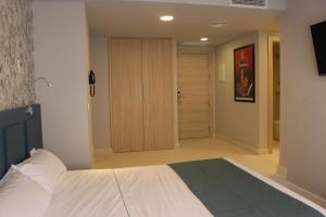 Postel nebo postele na pokoji v ubytování Modo Hotel Apartamento
