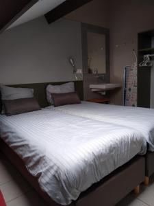 Postel nebo postele na pokoji v ubytování Boszicht 4 appartement in Oostkapelle